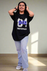 Person wearing a black t-shirt with text and graphics on a blue background