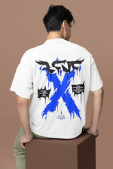 Person wearing a white t-shirt with blue and black designs on the back against a brown background