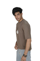 Kapda Kulture brown puff print oversized t shirt for men anime graphic design side profile walking
