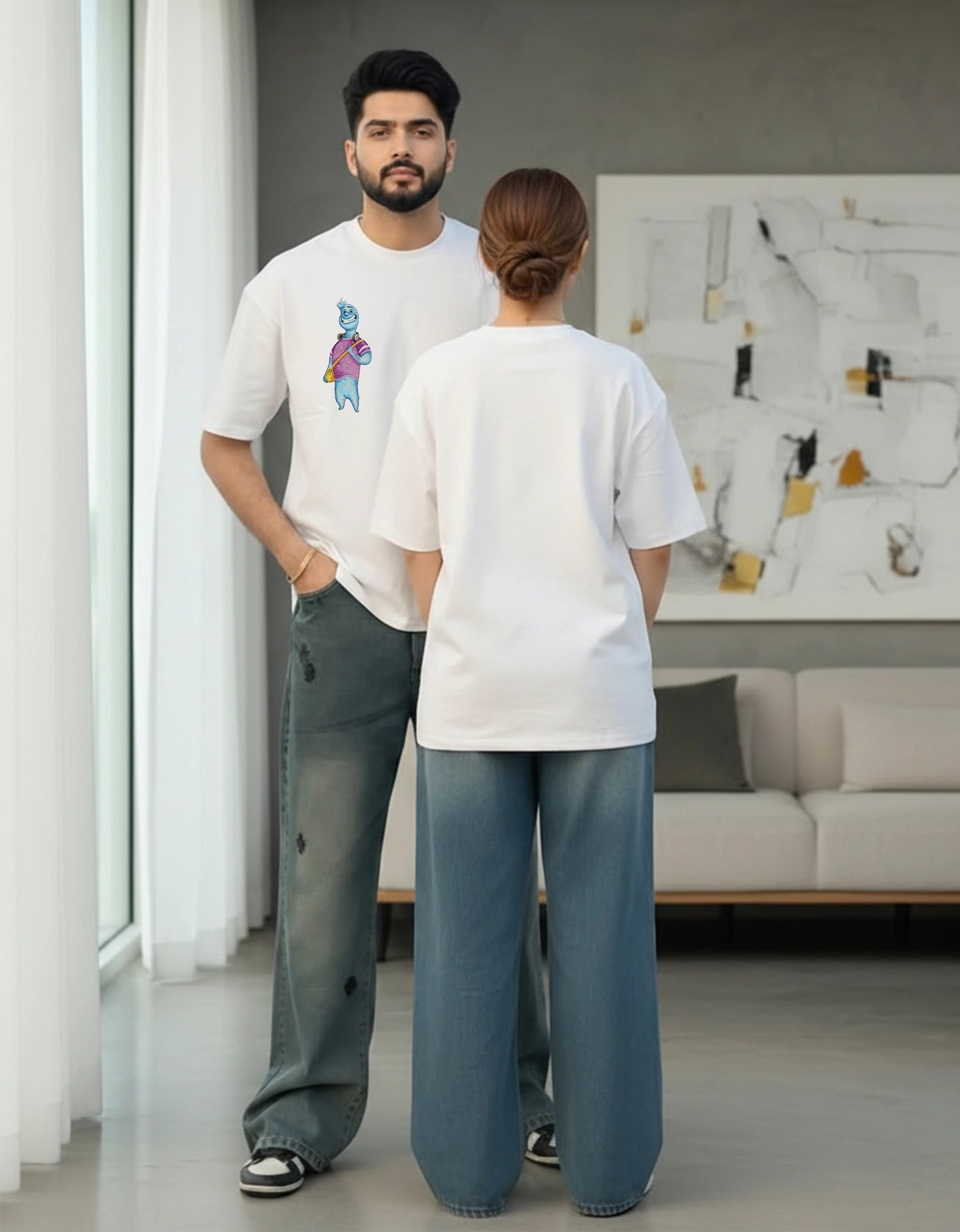 Couple standing together in comfortable white oversized t-shirts with minimal design
