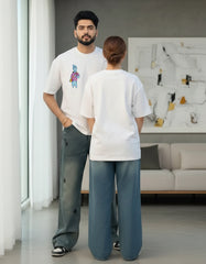 Couple standing together in comfortable white oversized t-shirts with minimal design