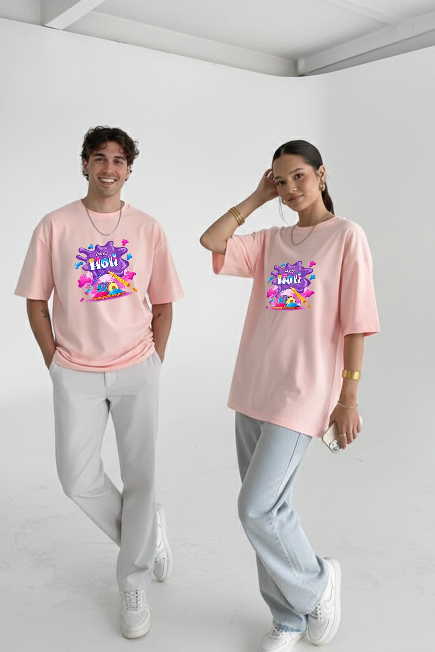 Couple wearing oversized Holi t shirts India Kapda Kulture relaxed fit streetwear festival outfit