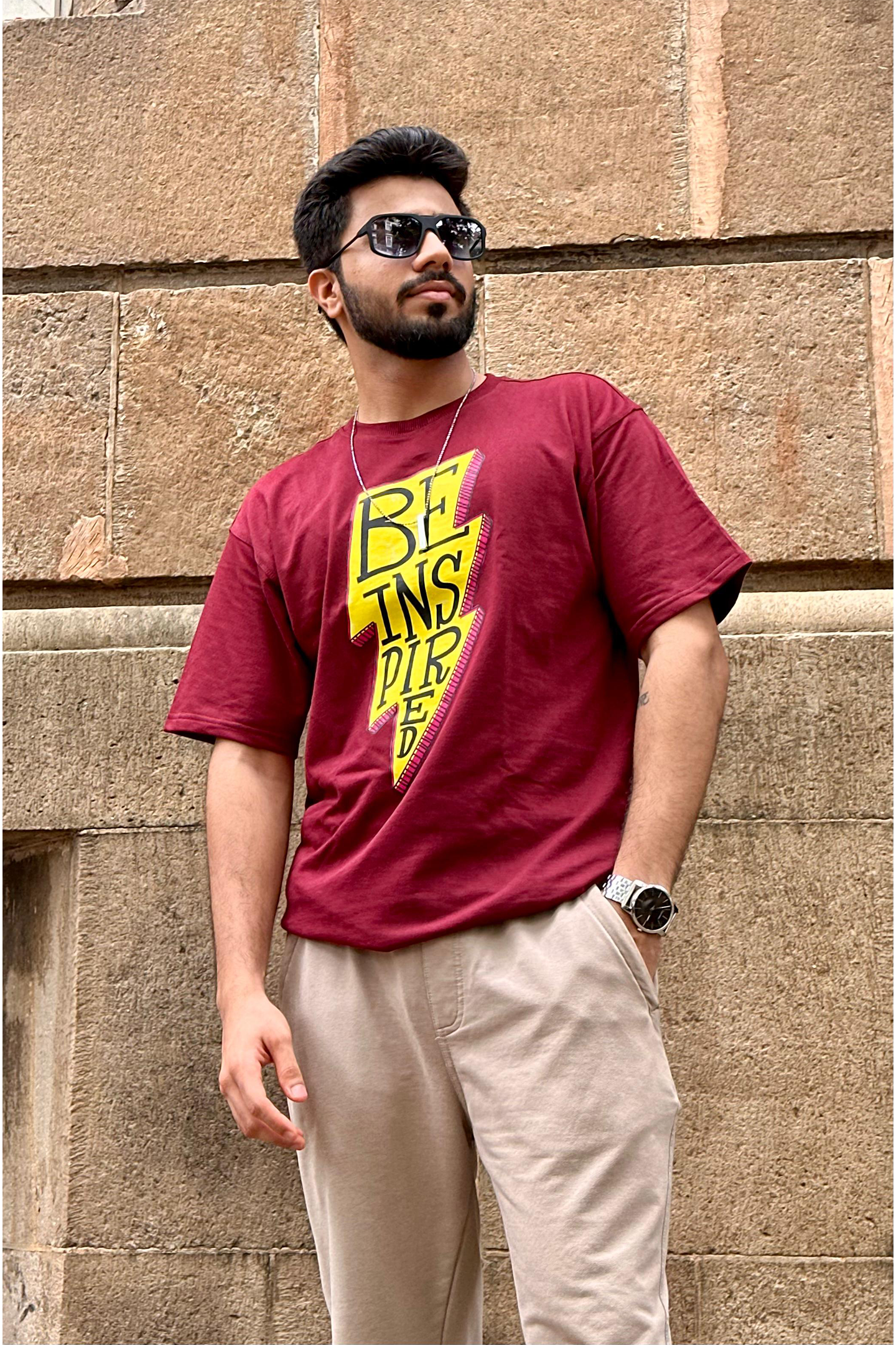 Person wearing a black Venum t-shirt with logo on the back