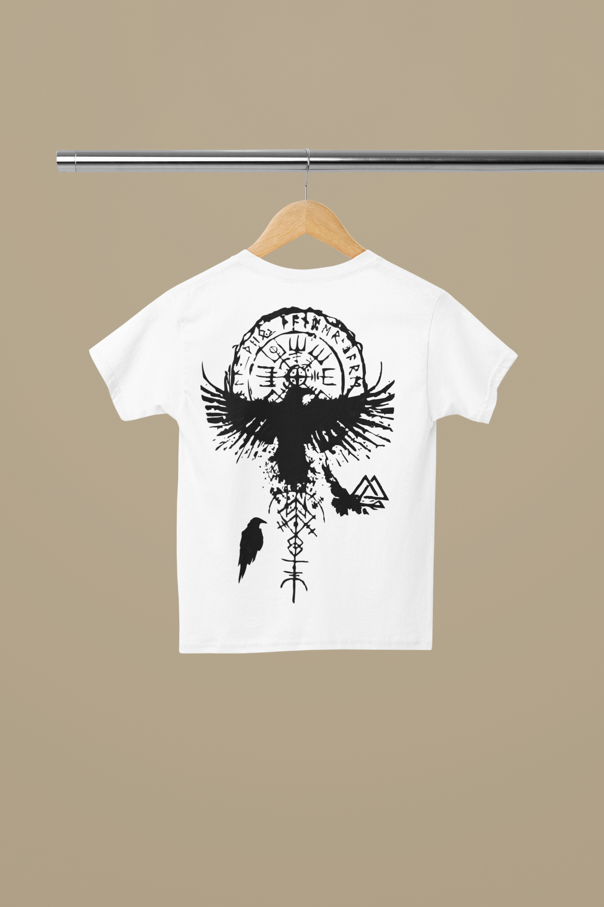White t-shirt with black eagle and circle design on a beige background