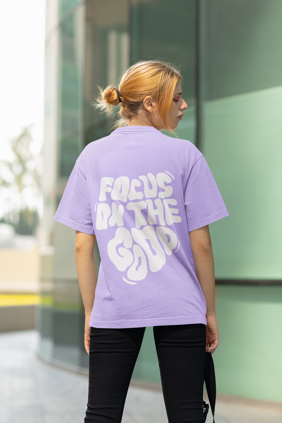 Person wearing a purple t-shirt with 'Focus on the Good' text, standing outdoors Oversized T-Shirt From Kapda Kulture