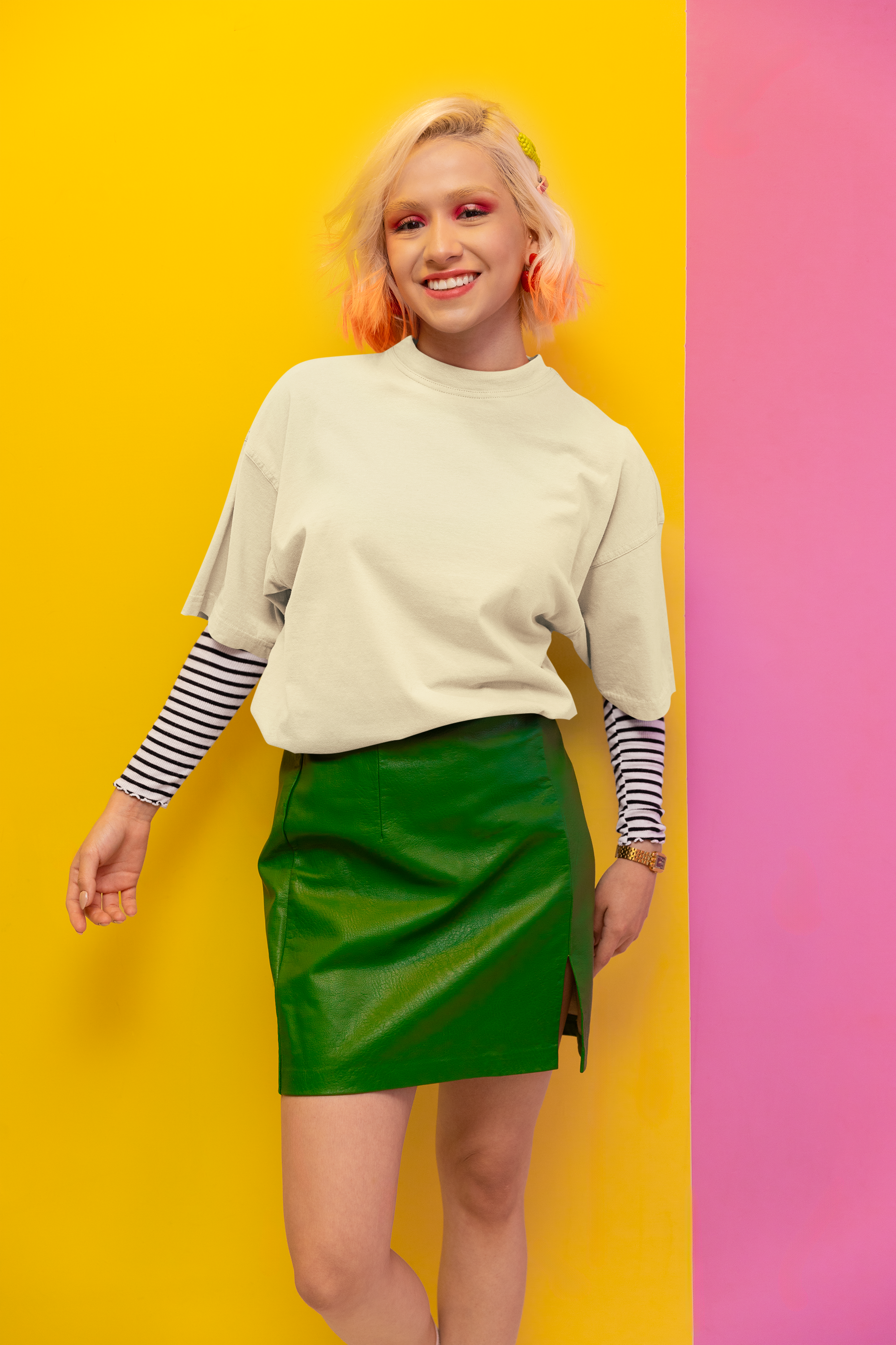 Woman wearing a green skirt and light sweater against a yellow and pink background Oversized T-Shirt From Kapda Kulture.