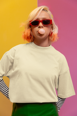 Person with colorful hair blowing a bubble against a multicolored background Oversized T-Shirt From Kapda Kulture.