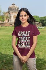 Person wearing a maroon t-shirt with 'GREAT GREAT GREAT ASTRONAUT' text in an outdoor setting.